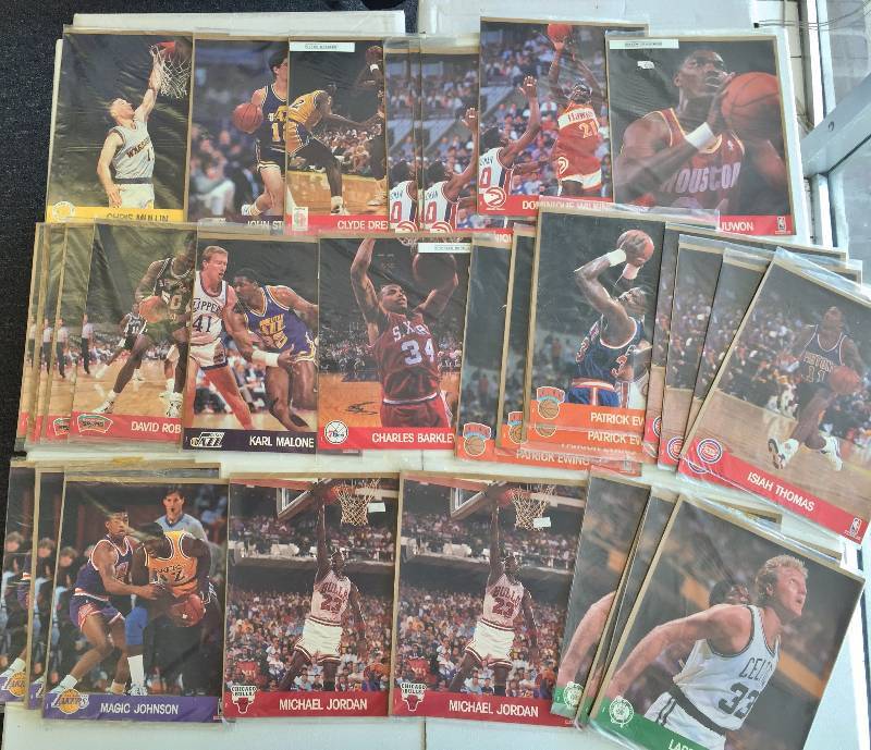 lot 1089 image: Amazing Lot of (32) 1990 Hoops Factory Sealed 8 x 10 Player Photo Cards - Superstars Only - Jordan, Larry Bird, Magic Johnson 