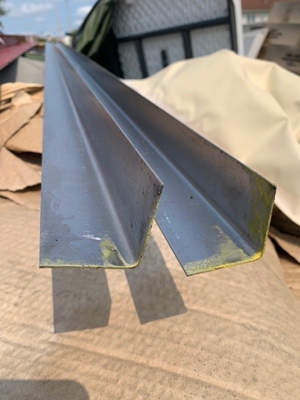 lot 1006 image: Lot of 6 10ft Long L Bar Steel Pieces