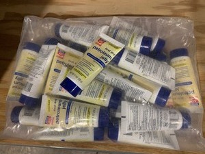 lot 5 image: Bag of Rite Aid First Aid Petroleum Jelly Skin Protectant Bottles