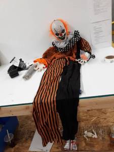 lot 5708 image: Holidayana Creepy Clown Halloween Animatronic - 5.6 ft Tall Animated Clown with Balloon Halloween Decoration, Sound and Touch Activated with Sounds, Lights and Movement