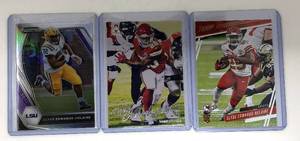 lot 1111 image: Three Mint 2020 Panini Clyde Edwards-Helaire Rookie Cards - All for One Money - Prizm Draft Picks (2021), Prestige, Luminence