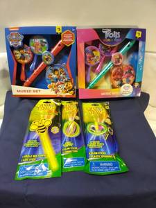 lot 155 image: Paw Patrol and Trolls Music Sets and Glow Stix