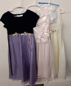 lot 24 image: 3 Dresses, Pink Sz.14, Eggshell & PurpleBlack Sz.16, (Eggshell does come with Pearl Bracelet, Necklace, (unauthenticated) & Veil)
