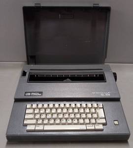lot 218 image: Smith Corona Electric Typewriter W Cover & Spell Corrector