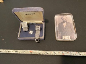 lot 107 image: Cuff links and Abe Lincoln paperweight
