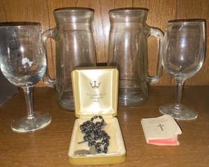 lot 272 image: Catholic prayer book w rosary and coins, glasses and mugs