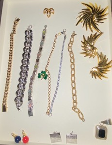 lot 276 image: Goldsilver toned bracelets, brooch and earring set, calendar pendants