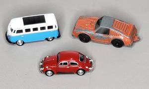 lot 97 image: Vintage Tootsie Toy Porsche & 1962 VW Bus & 1967 VW Beattle by Jada Toys