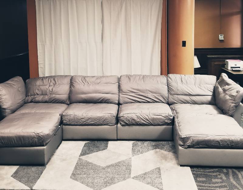 lot 150 image: Modular Sectional Sofa w6 Seats  6 Roll Arm SidesBacks Retail $7,750 (12 Boxes) - Tan