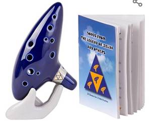 lot 717 image: Deekec Zelda Ocarina 12 Hole Alto C with Song Book (Songs From the Legend of Zelda) with Display Stand Protective Bag