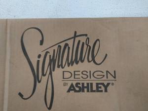 lot 30141 image: Signature Design by Ashley Modular Cabinet 4 ft. Tall
