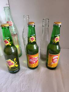 lot 1018 image: Dale Earnhardt Sun Drop soda and other old soda bottles including Dr Pepper