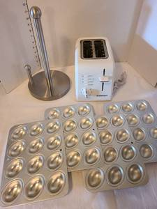lot 1112 image: Cuisinart toaster, paper towel holder, four egg shaped muffin pans