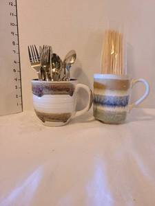 lot 1121 image: Two large pottery mugs, eating utensils and skewers