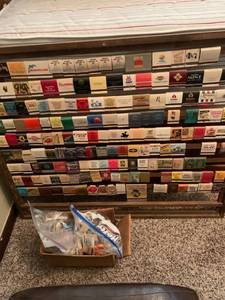 lot 1601 image: Assorted match books on a display board