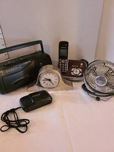 lot 1298 image: Personal fan, clock, camera, phone, radio with no cord or batteries