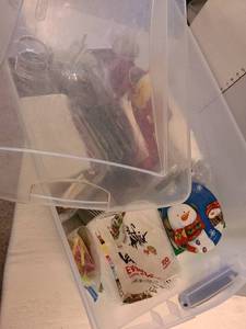 lot 1320 image: Sterilite 105 qt bin with napkins and disposable flatware and cups