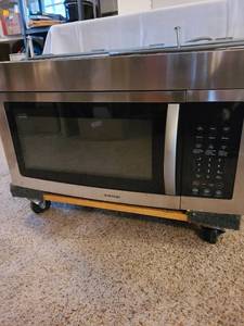 lot 1322 image: Samsung under counter microwave. Measures 30 wide, 16 high, 15.25 deep not including handle. Does not include cart its on.