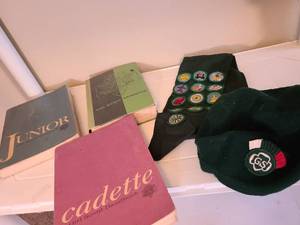 lot 1743 image: Girl scout books, sash and hat