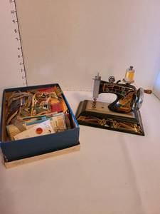 lot 1161 image: Miniature sewing machine and notions