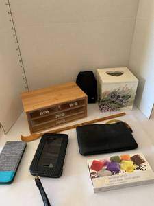 lot 1402 image: Soap, tissue holder, phone cases, back scratcher and make up bag