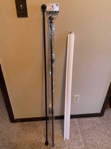 lot 1769 image: Pull shade approximately 41 inches and two curtain rods