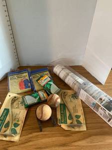 lot 2050 image: Peel and stick wallpaper, plant brackets, rain ponchos and emergency blanket