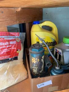 lot 2051 image: Prestone coolant, oil, part of a car jack and a wash mitt for cars