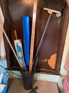 lot 2099 image: A genie extension spring with safety cable, cane, rulers, broom, plastic cemetery buckets and flower spray holders