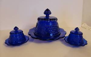 lot 106 image: 3 Vintage Cobalt Blue Glass Butter or Cheese Dishes with Grapes and Cable Design