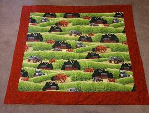 lot 127 image: 44 x 59 Quilted Lap Throw
