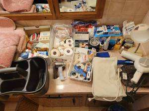 lot 297 image: Bathroom Medicine Cabinet Supplies (Bandages, Medications, Q-tips, Hair Dryer, Make-up Mirror)