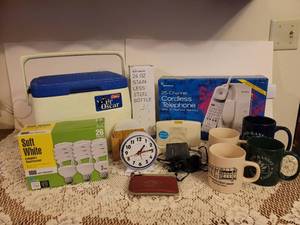 lot 306 image: 25 Channel Cordless Telephone, NIB 24oz.Stainless Steel Bottle, Light Bulbs, Coffee Mugs, Walkman, Clock, Etc.