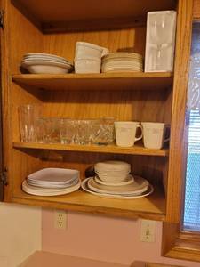 lot 343 image: Contents of Kitchen Cabinet (Corelle, Corning Ware, Glasses, Coffee Cups) BRING YOUR OWN BOXES