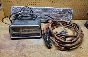 lot 458 image: Schumacher Battery Charger, Jumper Cables, and Car Visor
