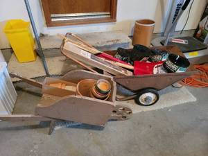lot 493 image: Metal Wheelbarrow, Planter Pole, New Show Shovel, Wooden Wheelbarrow with Garden Edging and Yard Sticks with Advertisement