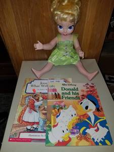 lot 148 image: Doll and books