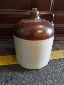 lot 1050 image: Brown and White Moonshine Jug
