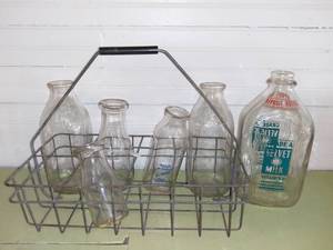 lot 20620 image: Antique Wire Milk Carrier and Milk Bottles