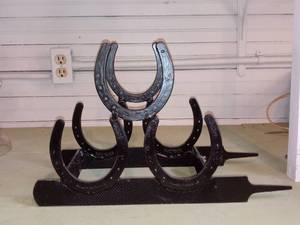 lot 33809 image: Cool Black Wine Rack Made Of Horseshoes And Files