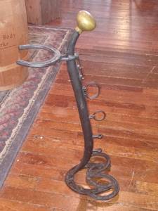 lot 33811 image: Black Horseshoe And Harness Ashtray Stand