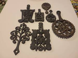 lot 1387 image: Lot of 7 Cast Iron Trivets