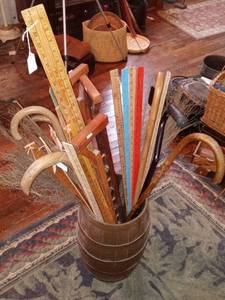lot 33823 image: Plastic Barrel Ful Of Walking Sticks And Measuring Sticks In Various Sizes