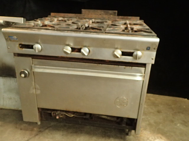 lot 23 image: U.S. Range 6 Burner Natural Gas Range and Full Size Oven