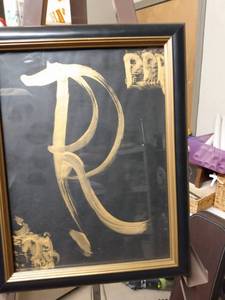 lot 4159 image: framed gold on black picture of a double r 11 and a half inches wide 14 and a half inches tall