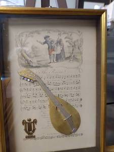 lot 4244 image: framed vintage 3D print of musical instrument and music 12 in wide 17 in tall
