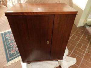lot 33105 image: Awesome wood piano roll cabinet full of various piano rolls