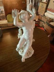 lot 33270 image: Porcelain cherub statue