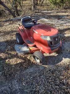 lot 4419 image: Troy-Bilt 7 speed pony with 42 inch deck has been sitting about 6 months started with a jump put it in the gear drive it and it broke a belt buying as is
