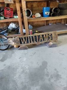 lot 4434 image: yard art name plate made out of wood name is Williams 6 ft wide 22 in tall three pieces